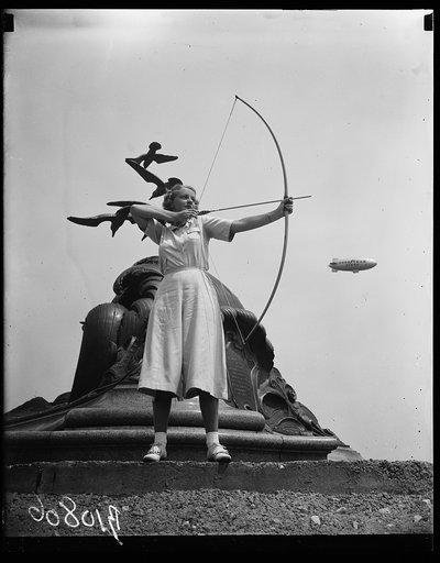 Archery, Goodyear blimp in background. Washington, D.C.