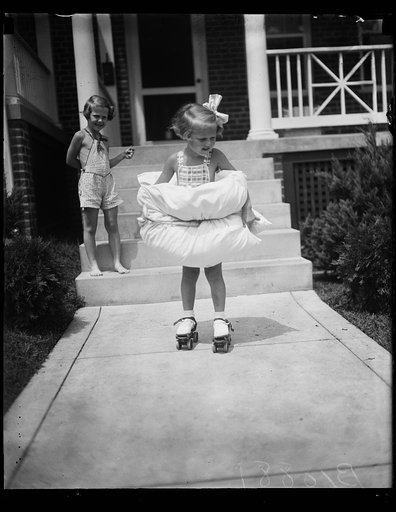 Safety first for this Miss, Washington, D.C. August 8. Equipped with bumpers fore and aft, 4-year-old Betty Buck is taking unnecessary chances as she tries her first pair of roller skates