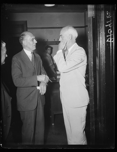 General Motors Executive testifies before SEC. Washington, D.C., Aug. 12. Charles F. Kettering, (left,) Vice President at General Motors, talks to Robert E. Healy, member of the Securities Exchange Commission, before taking the stand today at the S.E.C. hearing investigating investment trusts. Quest