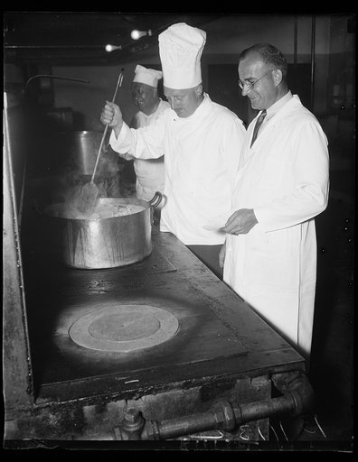 "What no spinach?????" Washington, D.C. September 8. It looks like hard work for Chef Joe Teophile (left) and J. Tervay (right). For theirs is the job of getting up the food for the banquet to be held in honor of the delegates to the Thrid World Power Conference which is being held here. The banquet