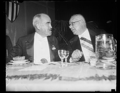 Washington, D.C., September 11. Morris L. Cooke, Chief of the Rural Electrification Administration, chats with Senator Leon Perrier, President of the Superior Council Electricity and Chairman of the French Delegation to the World Power Conference, at Union Station last night