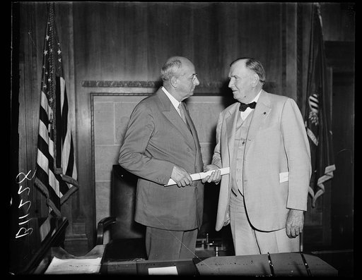 Homer S. Cummings, left