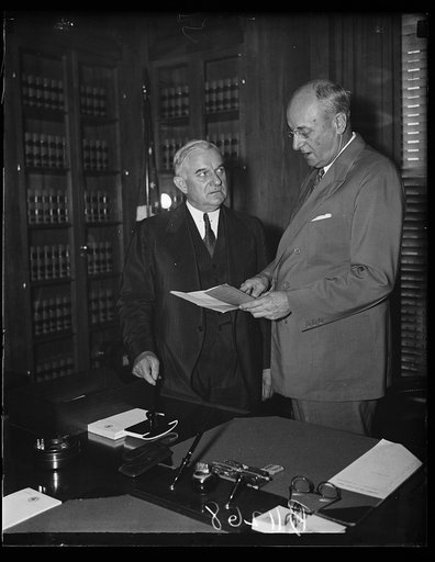 Homer S. Cummings, right