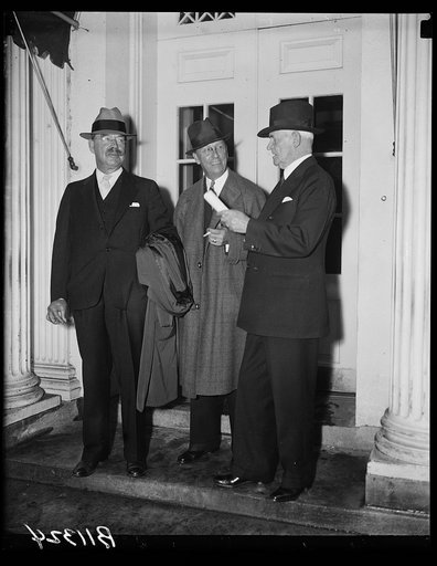 Maritime Commission at White House, Washington, D.C., Sept. 30. The members of the newly created Maritime Commission were called to the White House today for their first conference with President Roosevelt. Left to right: Rear Admiral Montgomery Taylor; George Landick, Jr., and Rear Admiral Henry A.