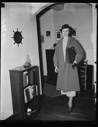 No. 3. Mrs. Moore leaves her apartment for day's duties. A long walk which keeps her in the best of physical condition is also on Mrs. Moore's daily program