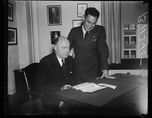 New and retiring heads of Veterans of Foreign Wars, Washington, D.C. Oct. 2. Bernard W. Kearney, (seated) recently elected National Commander of the Veterans of Foreign Wars at their annual convention in Denver, pictured at the national headquarters here with his predecessor James Van Zandt. Kearney
