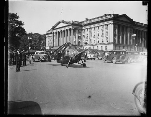 Washington sees new type autogiro, Washington, D.C. Oct. 2. An experimental auto giro, capable of being driven on highways as well as being flown in the air, was delivered to the Bureau of Air Commerce today at the Department Commerce today at the Department Commerce building . The ship, piloted by 
