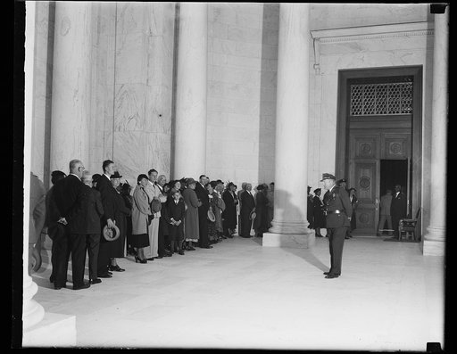 Crowd seeks admittance to U.S. Supreme Court, Washington, D.C. Oct. 5. The United States Supreme Court convened for the new term today, during which they must determine the validity of 10 important New Deal measures. This picture shows part of the crowd waiting in the corridor of the Supreme Court b