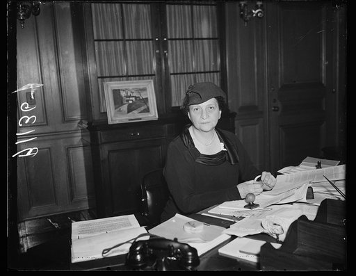 Madame Secretary. Washington, D.C., Oct. 6. A new and informal photograph of Secretary of Labor Perkins, made at her desk in the Labor Department today