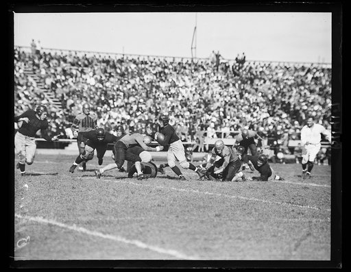 Navy beats William & Mary. Annapolis, MD, Sept. 25. Navy pried the lid off the 1936 football season here today by trouncing a game but outplayed William & Mary eleven. 18-6. Schmidt, Navy's hard-driving back, is shown going thru William & Mary's line