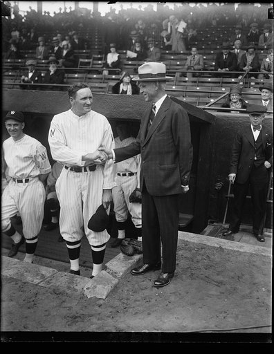 "Old Fox" wishes "Big Train" luck on opening of 1930 season. Clark Griffith, president of the Wash. Baseball Club, wishes the best of luck to Walter Johnson, manager of the team, just before the opening game today between Washington and Boston