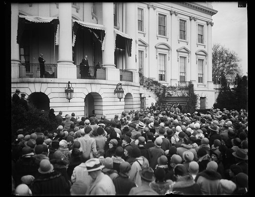 President Hoover greets Washington youngsters as they roll Easter eggs on White House lawn. Following the custom of other years the White House gates were opened bright and early today to allow thousands of Washington youngsters to roll their gayly colored Easter eggs on the historic south lawn. Pre