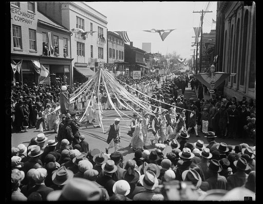 School children march in parade to welcome Apple Blossom Festival time in Virginia. A scene at the parade in Winchester, Va., today when 10,000 school children marched to celebrate the opening of the Apple Bblossom Festival in the historic Shenandoah Valley. Miss Sue Pollard, daughter of the Governo