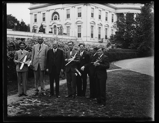 Herbert Hoover and group with toy airplanes outside White House, Washington, D.C.