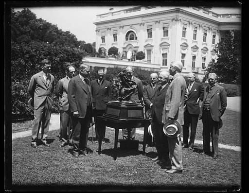 Herbert Hoover and group with sculpture outside White House, Washington, D.C.
