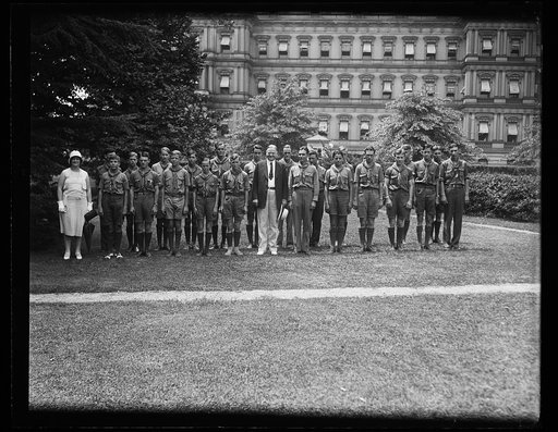 Herbert Hoover and group of scouts; State War and Navy building in background, Washington, D.C.