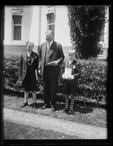 Herbert Hoover with two children outside White House, Washington, D.C.