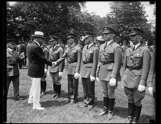 Herbert Hoover greeting military outside White House, Washington, D.C.