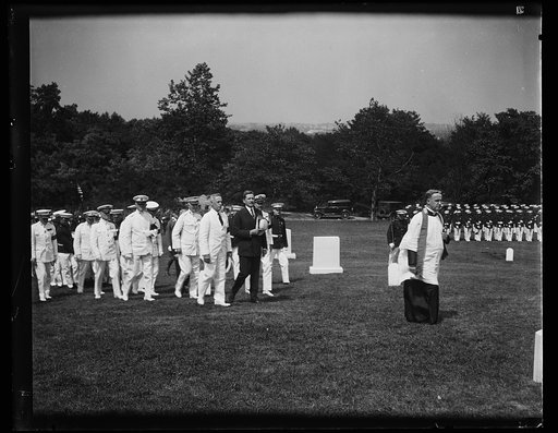 Group at cemetery; Patrick J. Hurley, center, dark suit