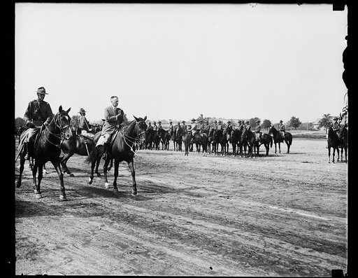 Henry Stimson riding past Cavalry