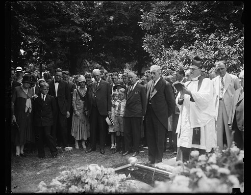 Walter Johnson's wife buried. This photograph was taken at the funeral of Mrs. Walter Johnson, wife of the manager of the Washington baseball club. Those in the picture, reading from left to right, include: Mrs. Frank N. Johnson of Coffeyville, Kas., his mother; Walter Johnson; Edwin Johnson, a son;