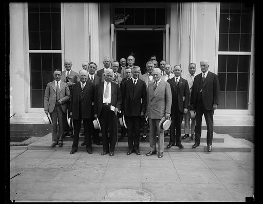 Bankers and drought relief plans. Twelve drought-stricken states sent representatives, most of them well known bankers, to confer with President Hoover and his relief committee to discuss plans for extending financial aid to farmers. Secretary of Agriculture Hyde is in the center of the photograph. 