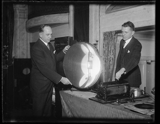 Makes light speak like Biblical burning bush. Like the voice speaking to Moses from the burning bush as described in the Bible, Sergius P. Grace, Assistant Vice-President of the Bell Telephone Laboratories, makes speech and music issue from the burning electric arc in the center of the projector sho