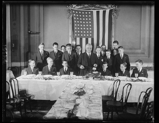 Vice-president entertains pages. One of the yuletide events the pages of the Senate look forward to with anticipation is the annual dinner given for them by Vice-President Charles Curtis. The photograph shows the pages at this year's party, with their genial host about to carve the turkey. 12/24/30