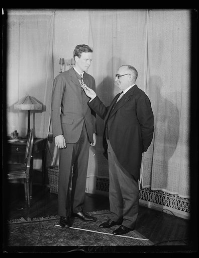 Lindbergh receives French decoration. Col. Charles A. Lindbergh receives the cross of Commander of the Legion of Honor, bestowed by the French government in commemoration of his famous Atlantic flight, presented by French Ambassador Paul Claudel. Rear Admiral Richard E. Byrd will receive a similar d