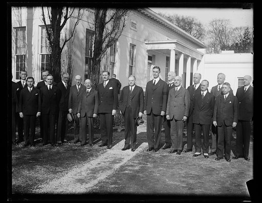 Hoover greets military order vets. President Hoover greets members of the Military Order of World War Veterans during their annual convention in Washington. Left to right; T.J. Cowie, Secretary of War Hurley, President Hoover, John Ross Delafield, commissioner in charge of the organization. 1/31 [Wh