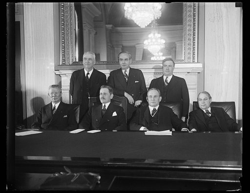 Group at table; Patrick J. Hurley, front row, 2nd from left