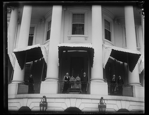 Lou and Herbert Hoover on White House porch with children, Washington, D.C.