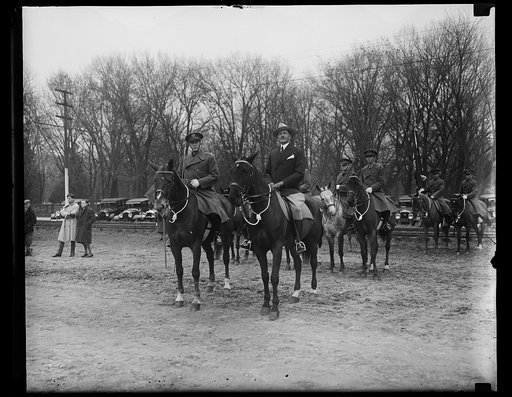 Men on horseback; Patrick J. Hurley, center