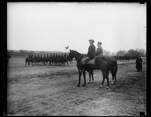 Cavalry; Patrick J. Hurley on horsback in foreground
