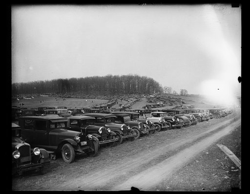 Automobiles parked in field