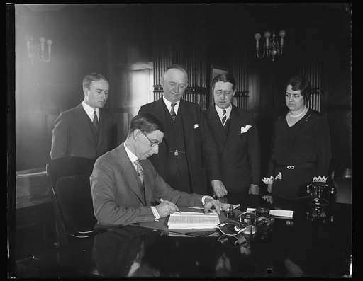Group; Ray Wilbur at desk