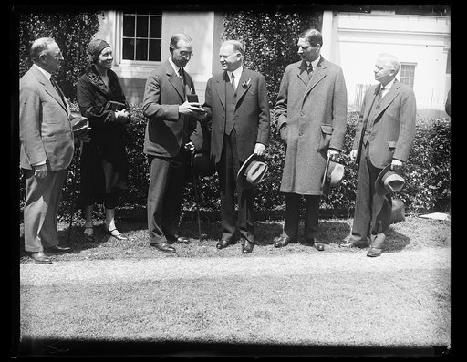 Group outside White House; Herbert Hoover, center, and Ray Wilbur, 2nd from right