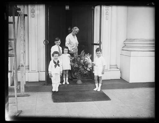 Lou Hoover and children with flowers at White House, Washington, D.C.