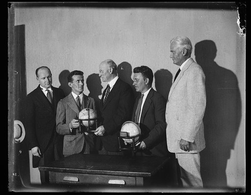 Group with globes: Robert P. Lamont, 3rd from right; Hiram Bingham, right