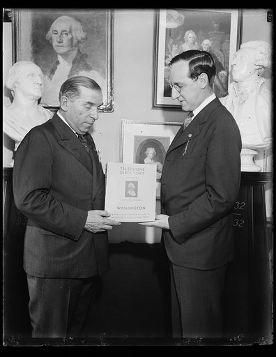 Men holding Washington telephone directory