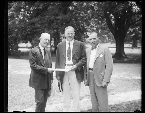 Herbert Hoover, center