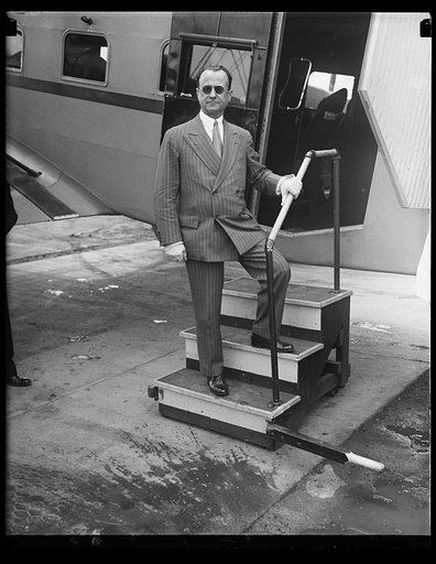 Man standing at airplane door