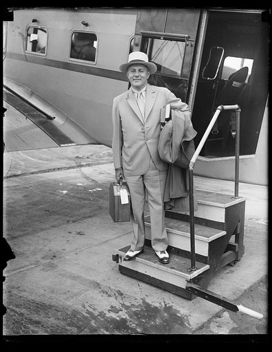 Man standing at airplane door