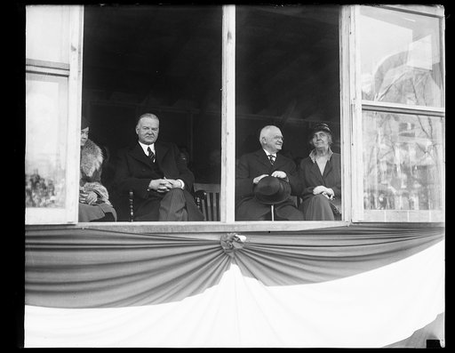 Parade viewing stand: Herbert Hoover, left; Lou Hoover, right