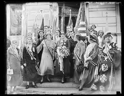 First Lady attends convention session of C.A.R. Mrs. Herbert Hoover warmly greeted as she arrived at the Corcoran Art Gallery in Washington to attend a convention session of the Children of the American Revolution. In the center of photograph, left to right: Mrs. Lawrence Quirola, National Vice Pres