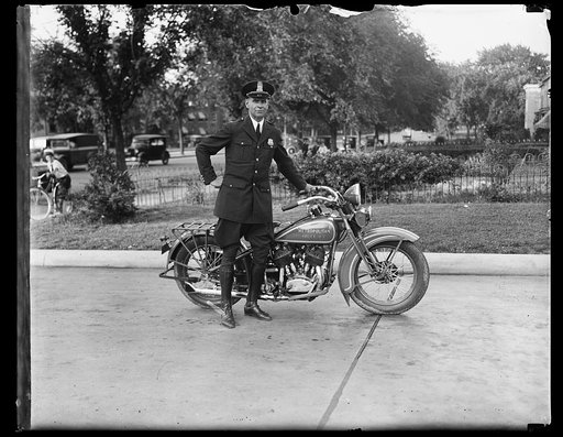 Metropolitan police officer with motorcycle. Washington, D.C.