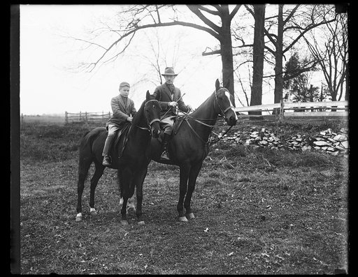 Man and boy on horseback