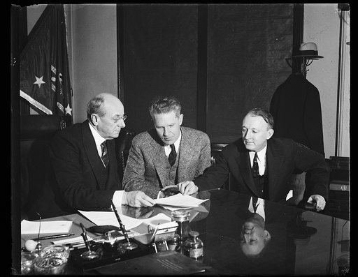 Homer S. Cummings, left