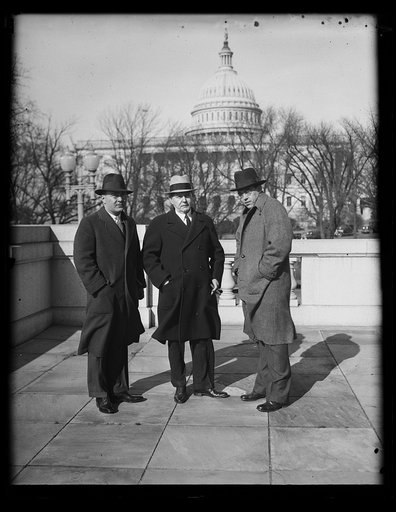 Three men, U.S. Capitol in background. Washington, D.C.