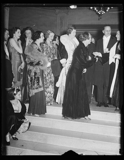 Group in formal clothing; Harry Hopkins, right